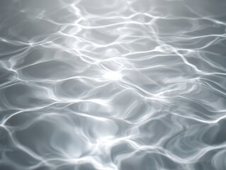 Fototapeta premium Aqua Serenity: Close-up shot captures the mesmerizing dance of light and shadow on the water's surface. The rippling water creates an abstract display.