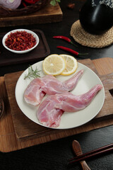 Fresh Raw Rabbit Foreleg Meat with Sichuan Peppers and Lemon for Traditional Asian Cuisine Cooking