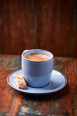Cup of coffee on rustic wooden background. Soft focus. Copy space	