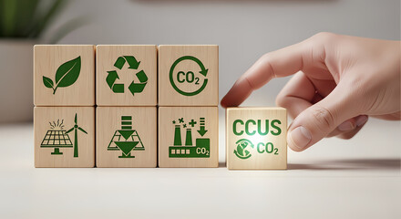 Hand adding a CCUS block to other sustainable energy and environmental icons, symbolizing carbon capture technology as a key climate solution.