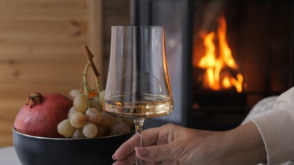 Slow living scene with wine and fruits by fire reflecting cozy lifestyle in warm home Atmosphere of relaxation shows intimate connection with home turning ordinary moment into harmony of home warmth