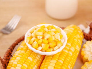 Fresh Golden Sweet Corn Kernels and Cobs in Rustic Kitchen Setting