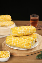 Fresh Golden Sweet Corn Cobs on Wooden Cutting Board with Tea Glass Kitchen Food Photography