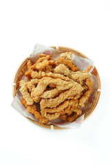 Crispy Fried Pork Rinds in Bamboo Basket - Traditional Asian Street Food Snack