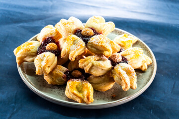 Puff pastry flower with raspberry jam filling. Baked goods. Desserts. Food concept.