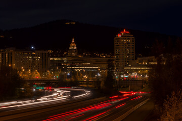 Fototapeta premium City Skyline at Night with Red and White Light Streaks. Mock up promotion information for marketing announcements and details, blank white space.