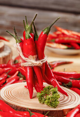 Red Hot Chili Peppers Bundle on Wooden Board - Spicy Cooking Ingredients