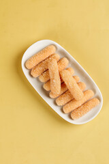 Traditional Chinese Glutinous Rice Sticks Guo Jing Beijing Dim Sum on Yellow Background