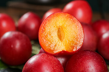 Fresh Red Plums Cut in Half Showing Juicy Yellow Flesh - Premium Stone Fruit