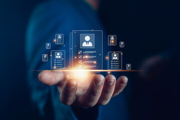 Businessman holding glowing digital resume icons, concept of recruitment technology, HR management, candidate selection, employee evaluation, job application, workforce hiring, digital acquisition,