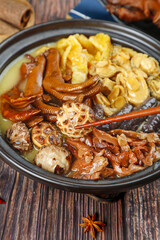 Asian Hot Pot with Mushrooms Tofu and Vegetables in Clay Pot Traditional Chinese Cuisine