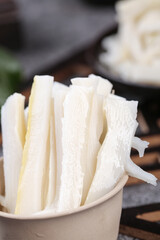 Fresh Sliced Bamboo Shoots in Natural Container Ready for Asian Cooking