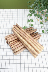 Fresh Yam Sticks from Henan Farmers Market on White Tiles with Green Plant