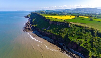 Coastal cliffs meet verdant fields