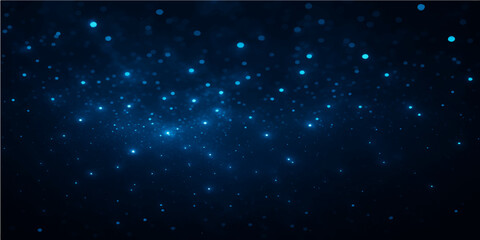 Starry blue abstract background illustrating a cosmic night sky with glowing particles and dust
