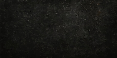 An aged, dirty, dark black grunge texture like old concrete or a rough gray stone wall surface can be used as a vintage design backdrop or blank pattern wallpaper