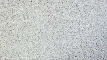 Texture of the grey plaster applied on a wall surface as a design background