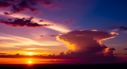 Dramatic sunset paints the sky with vibrant colors and cloud formations
