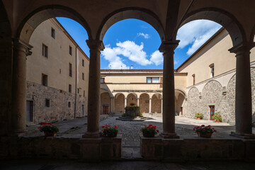 Naklejka premium Cloister of Abbazia di San Salvatore, romanesque styled medieval church in Tuscany, Italy 