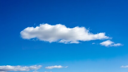 Fluffy white cloud against blue sky, minimalist nature composition with ample negative space and soft daylight. travel magazines.