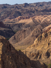 Vivid red rock canyon in Central Asian mountains, displaying nature's powerful artistry