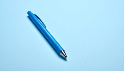 Fototapeta premium Sharpened blue pencil on light blue surface with pigment smear.