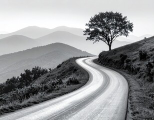 Winding road through misty mountains
