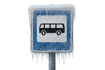 Bus stop sign covered with ice and icicles