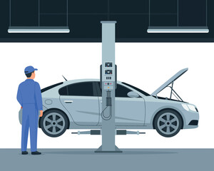 Mechanic inspecting car lifted on hydraulic car lift in auto repair shop