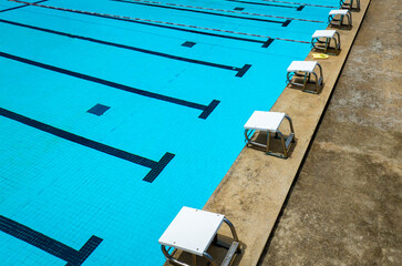 Aerial view of empty Olympic swimming pool , blue water background