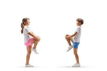 Obraz premium Full length profile shot of children stretching knees