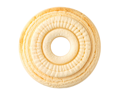 A pale yellow, ring-shaped cookie with concentric embossed circles and a central hole, showing a slightly textured surface