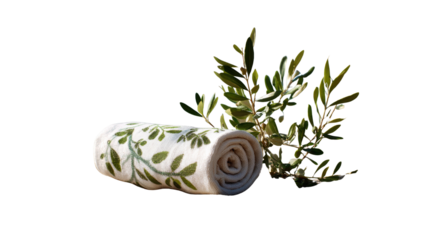 Rolled Towel with Olive Branch: A tranquil shot of a rolled up towel decorated with plant patterns next to a fresh olive branch. A minimalist approach with neutral hues creates a relaxing ambiance