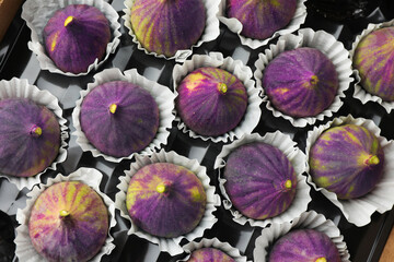 Fresh ripe figs in box, top view