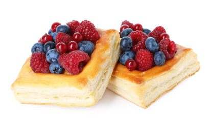 Yummy puff pastries with berries isolated on white