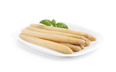 Pickled asparagus spears with basil isolated on white