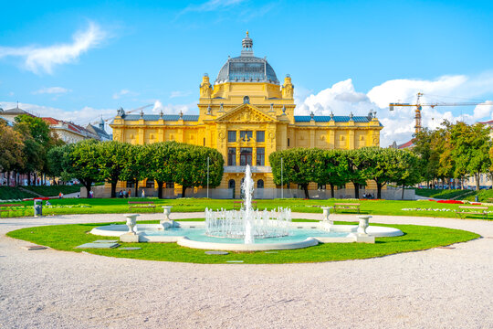 View of the Trg Kralja Tomislava. Art Pavilion with a decorative fountain and green park in Zagreb, Croatia. A famous cultural landmark and architectural attraction