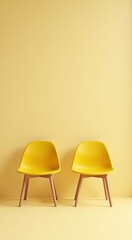 Obraz premium Two yellow chairs sitting next to each other in a room hiring job