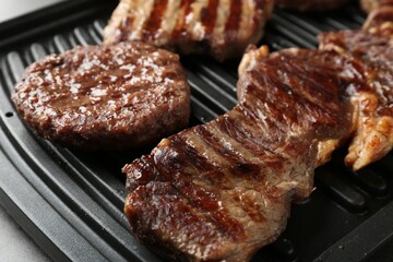 Delicious grilled beef meat on table, closeup