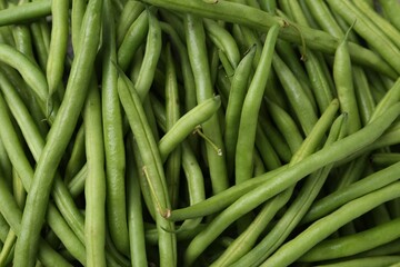 Fresh green bean pods as background, closeup