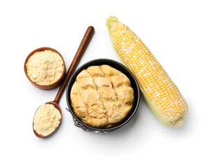 Freshly baked cornbread loaf, flour and cob isolated on white, top view