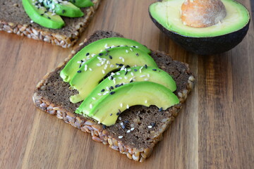 Avocado Toast with Sesame Seeds on Whole Grain Bread close up