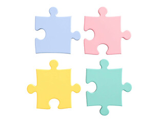 Obraz premium Four pastel-colored puzzle pieces, two light blue and pink, two pale yellow and green, interlocked in a square formation