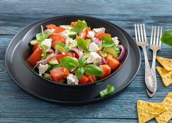 tomato cucumber salad with goat cheese, basil