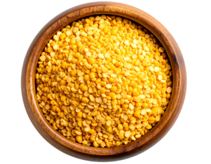 Overhead shot of a wooden bowl brimming with split yellow peas, showcasing their vibrant color and texture.  The peas are densely packed, filling the bowl completely