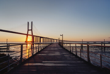Sunrise Over Vasco da Gama Bridge Spanning the Tagus River in Lisbon, Portugal