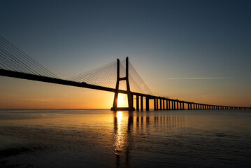 Sunrise Over Vasco da Gama Bridge Spanning the Tagus River in Lisbon, Portugal