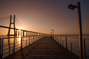 Sunrise Over Vasco da Gama Bridge Spanning the Tagus River in Lisbon, Portugal