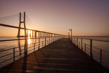Sunrise Over Vasco da Gama Bridge Spanning the Tagus River in Lisbon, Portugal