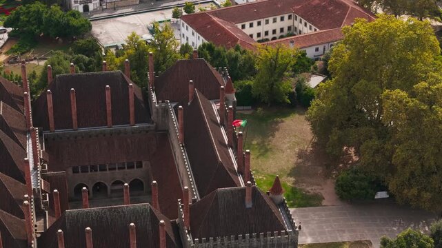 aerial - portugal flag waving on palace of the dukes of braganza guimaraes portugal